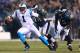 PHILADELPHIA, PA - NOVEMBER 26: Cam Newton #1 of the Carolina Panthers eludes Derek Landri #94 of the Philadelphia Eagles during their game at Lincoln Financial Field on November 26, 2012 in Philadelphia, Pennsylvania. (Photo by Al Bello/Getty Images)