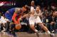 NEW YORK, NY - NOVEMBER 26: Carmelo Anthony #7 of the New York Knicks and Deron Williams #8 of the Brooklyn Nets fight for a loose ball at the Barclays Center on November 26, 2012 in the Brooklyn borough of New York City. NOTE TO USER: User expressly acknowledges and agrees that, by downloading and/or using this photograph, user is consenting to the terms and conditions of the Getty Images License Agreement. The Nets defeated the Knicks 96-89. (Photo by Bruce Bennett/Getty Images)
