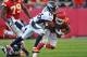 KANSAS CITY, MO - NOVEMBER 25: Free safety Rahim Moore #26 of the Denver Broncos tackles running back Jamaal Charles #25 of the Kansas City Chiefs during the second half on November 25, 2012 at Arrowhead Stadium in Kansas City, Missouri. Denver defeated Kansas City 17-9. (Photo by Peter Aiken/Getty Images)