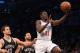 NEW YORK, NY - OCTOBER 19: Jrue Holiday #11 of the Philadelphia 76ers scores on a lay up against the Brooklyn Nets during the first quarter of a preseason game at the Barclays Center on October 19, 2012 in the Brooklyn borough of New York City. NOTE TO USER: User expressly acknowledges and agrees that, by downloading and/or using this photograph, user is consenting to the terms and conditions of the Getty Images License Agreement. (Photo by Bruce Bennett/Getty Images)