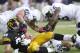 IOWA CITY, IOWA - OCTOBER 20: Tight end C.J. Fiedorowicz #86 of the Iowa Hawkeyes is brought down during the second quarter by linebackers Glen Carson #40, Gerald Hodges #6 and Michael Mauti #42 of the Penn State Nittany Lions on October 20, 2012 at Kinnick Stadium in Iowa City, Iowa. Penn State defeated Iowa 38-14. (Photo by Matthew Holst/Getty Images)