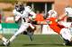 COLUMBUS, OH - NOVEMBER 17: Dri Archer #1 of the Kent State Golden Flashes breaks a tackle by Paul Swan #33 of the Bowling Green Falcons on November 17, 2012 at Doyt Perry Stadium in Bowling Green, Ohio. Kent State defeated Bowling Green 31-24. (Photo by Kirk Irwin/Getty Images)