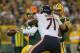 GREEN BAY, WI - SEPTEMBER 13: Aaron Rodgers #12 of the Green Bay Packers passes as Bryan Bulaga #75 blocks Israel Idonije #71 of the Chicago Bears at Lambeau Field on September 13, 2012 in Green Bay, Wisconsin. The Packers defeated the Bears 23-10. (Photo by Jonathan Daniel/Getty Images)