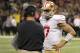 November 25, 2012; New Orleans, LA, USA; San Francisco 49ers head coach Jim Harbaugh talks with quarterback Colin Kaepernick (7) during fourth quarter of their game against the New Orleans Saints at the Mercedes-Benz Superdome. The San Francisco 49ers defeated the New Orleans Saints 31-21. Mandatory Credit: John David Mercer-US PRESSWIRE