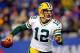 EAST RUTHERFORD, NJ - NOVEMBER 25: quarterback Aaron Rodgers #12 of the Green Bay Packers scrambles with the ball against the New York Giants at MetLife Stadium on November 25, 2012 in East Rutherford, New Jersey. (Photo by Rich Schultz/Getty Images)