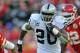KANSAS CITY, MO - OCTOBER 28: Running back Darren McFadden #20 of the Oakland Raiders rushes for a first down against the Kansas City Chiefs during the fourth quarter on October 28, 2012 at Arrowhead Stadium in Kansas City, Missouri. Oakland defeated Kansas City 26-16. (Photo by Peter Aiken/Getty Images)