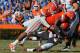 GAINESVILLE, FL - NOVEMBER 10: Defensive lineman Sharrif Floyd #73 of the Florida Gators tackles running back Alonzo Harris #46 of the Louisiana-Lafayette Ragin' Cajuns November 10, 2012 in Gainesville, Florida. Florida won 27 - 20. (Photo by Al Messerschmidt/Getty Images)