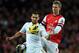LONDON, ENGLAND - DECEMBER 01: Itay Shechter of Swansea holds off Per Mertesacker of Arsenal during the Barclays Premier League match between Arsenal and Swansea City at the Emirates Stadium on December 1, 2012 in London, England. (Photo by Richard Heathcote/Getty Images)