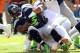MIAMI GARDENS, FL - NOVEMBER 25: Running back Marshawn Lynch #24 of the Seattle Seahawks is brought down against the Miami Dolphins at Sun Life Stadium on November 25, 2012 in Miami Gardens, Florida. (Photo by Marc Serota/Getty Images)