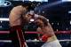 ARLINGTON, TX - NOVEMBER 13: Manny Pacquiao (R in white trunks) of the Philippines lands a punch against Antonio Margarito (black trunks) of Mexico during their WBC World Super Welterweight Title bout at Cowboys Stadium on November 13, 2010 in Arlington, Texas. (Photo by Nick Laham/Getty Images)