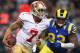 ST. LOUIS, MO - DECEMBER 2: Colin Kaepernick #7 of the St. Louis Rams looks to avoid being sacked by Jermelle Cudjo #93 of the St. Louis Rams at the Edward Jones Dome on December 2, 2012 in St. Louis, Missouri. The Rams beat the 49ers 16-13 in overtime. (Photo by Dilip Vishwanat/Getty Images)