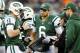 EAST RUTHERFORD, NJ - DECEMBER 02: Greg McElroy #14 of the New York Jets talks with quarterback coach Matt Cavanaugh while teammate Mark Sanchez#6 and Tim Tebow #15 stand by in the fourth quarter against the Arizona Cardinals on December 2, 2012 at MetLife Stadium in East Rutherford, New Jersey. The New York Jets defeated the Arizona Cardinals 7-6. (Photo by Elsa/Getty Images)
