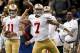 November 25, 2012; New Orleans, LA, USA; San Francisco 49ers quarterback Colin Kaepernick (7) passes as quarterback Alex Smith (11) looks on from the sideline during the first half of a game against the New Orleans Saints at the Mercedes-Benz Superdome. Mandatory Credit: Derick E. Hingle-USA TODAY Sports