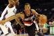 Dec 3, 2012; Charlotte, NC, USA; Portland Trail Blazers guard Damian Lillard (0) drives past Charlotte Bobcats guard Kemba Walker (15) during the game at Time Warner Cable Arena. Mandatory Credit: Sam Sharpe-USA TODAY Sports