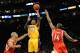 LOS ANGELES, CA - JANUARY 05: Kobe Bryant #24 of the Los Angeles Lakers shoots a jumper over Carl Landry #14 and Shane Battier #31 of the Houston Rockets during the first half at Staples Center on January 5, 2010 in Los Angeles, California. NOTE TO USER: User expressly acknowledges and agrees that, by downloading and/or using this Photograph, user is consenting to the terms and conditions of the Getty Images License Agreement. (Photo by Harry How/Getty Images)