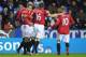 READING, ENGLAND - DECEMBER 01: Robin van Persie of Manchester United celebrates scoring a goal with teammates Chris Smalling, Michael Carrick and Wayne Rooney during the Barclays Premier League match between Reading and Manchester United at Madejski Stadium on December 1, 2012 in Reading, England. (Photo by Michael Regan/Getty Images)