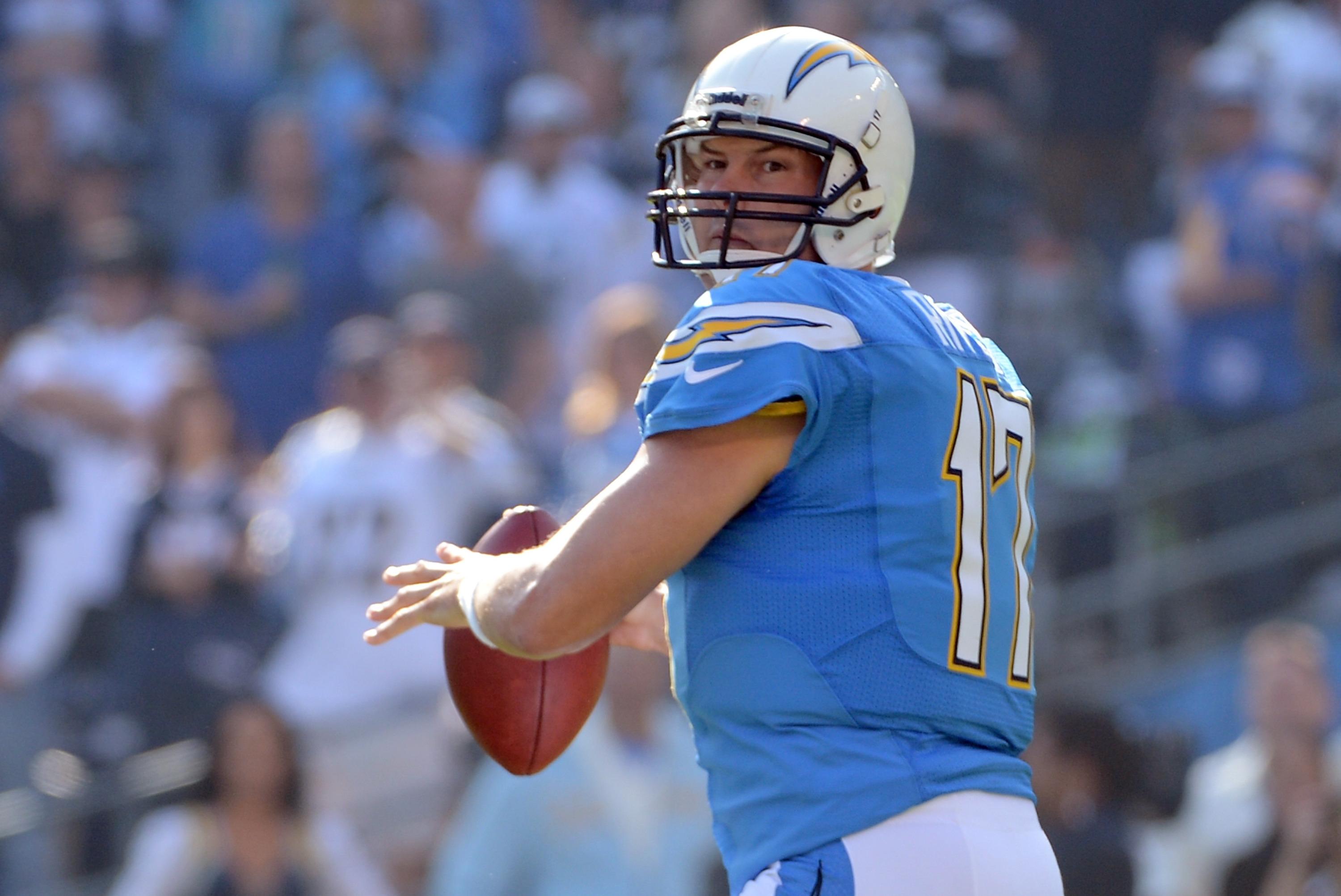 ADVANCE FOR WEEKEND EDITIONS JAN. 19-21 ** FILE ** Quarterback Philip  Rivers holds up his San Diego Chargers jersey at a news conference at the  Chargers' facility in San Diego in