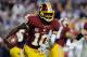 LANDOVER, MD - DECEMBER 03: Robert Griffin III #10 of the Washington Redskins scrambles with the ball in the second half against the New York Giants at FedExField on December 3, 2012 in Landover, Maryland. (Photo by Patrick McDermott/Getty Images)