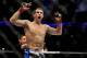 Apr 21, 2012; Atlanta, GA, USA; Rory MacDonald celebrates beating Chad Mills in a welterweight bout during UFC 145 at Philips Arena. MacDonald won the bout by technical knock out. Mandatory Credit: Paul Abell-USA TODAY Sports