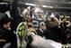 Dec 6, 2012; Oakland, CA, USA; Oakland Raiders running back Darren McFadden (20) leaps into the black hole fans after scoring a touchdown against the Denver Broncos during the second quarter at O.co Coliseum. Mandatory Credit: Kelley L Cox-USA TODAY Sports