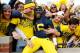 ANN ARBOR, MI - NOVEMBER 17: Denard Robinson #16 of the Michigan Wolverines celebrates a 42-17 victory over the Iowa Hawkeyes with fans at Michigan Stadium on November 17, 2012 in Ann Arbor, Michigan. (Photo by Gregory Shamus/Getty Images)