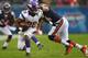 CHICAGO, IL - NOVEMBER 25: Adrian Peterson #28 of the Minnesota Vikings is horse collared by Brian Urlacher #54 of the Chicago Bears at Soldier Field on November 25, 2012 in Chicago, Illinois. (Photo by Dilip Vishwanat/Getty Images)