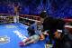 LAS VEGAS, NV - DECEMBER 08: Manny Pacquiao lays face down on the mat after being knocked out in the sixth round as Juan Manuel Marquez celebrates during their welterweight bout at the MGM Grand Garden Arena on December 8, 2012 in Las Vegas, Nevada. (Photo by Al Bello/Getty Images)