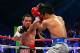 LAS VEGAS, NV - DECEMBER 08: (L-R) Juan Manuel Marquez throws a left at Manny Pacquiao during their welterweight bout at the MGM Grand Garden Arena on December 8, 2012 in Las Vegas, Nevada. (Photo by Al Bello/Getty Images)