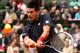 PARIS, FRANCE - JUNE 10: Novak Djokovic of Serbia plays a backhand during the men's singles final against Rafael Nadal of Spain on day 15 of the French Open at Roland Garros on June 10, 2012 in Paris, France. (Photo by Matthew Stockman/Getty Images)