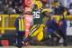GREEN BAY, WI - DECEMBER 9: DuJuan Harris #26 of the Green Bay Packers leaps into the end zone for a touchdown against the Detroit Lions at Lambeau Field on December 9, 2012 in Green Bay, Wisconsin. (Photo by Tom Lynn /Getty Images)