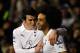 LONDON, ENGLAND - JANUARY 31: Gareth Bale of Spurs celebrates scoring their third goal with Benoit Assou-Ekotto of Spurs during the Barclays Premier League match between Tottenham Hotspur and Wigan Athletic at White Hart Lane on January 31, 2012 in London, England. (Photo by Paul Gilham/Getty Images)