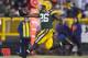 GREEN BAY, WI - DECEMBER 9: DuJuan Harris #26 of the Green Bay Packers leaps into the end zone for a touchdown against the Detroit Lions at Lambeau Field on December 9, 2012 in Green Bay, Wisconsin. (Photo by Tom Lynn /Getty Images)