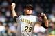 NEW YORK, NY - SEPTEMBER 27: Kevin Correia #29 of the Pittsburgh Pirates pitches against the New York Mets at Citi Field on September 27, 2012 in the Flushing neighborhood of the Queens borough of New York City. (Photo by Alex Trautwig/Getty Images)
