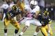 IOWA CITY, IOWA - OCTOBER 20: Tight end Kyle Carter #87 of the Penn State Nittany Lions rushes up field during the second quarter in front of safety Tom Donatell #13 and defensive back Tanner Miller #5 of the Iowa Hawkeyes on October 20, 2012 at Kinnick Stadium in Iowa City, Iowa. Penn State defeated Iowa 38-14. (Photo by Matthew Holst/Getty Images)
