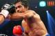 LAS VEGAS, NV - DECEMBER 08: (R-L) Manny Pacquiao throws a left at Juan Manuel Marquez during their welterweight bout at the MGM Grand Garden Arena on December 8, 2012 in Las Vegas, Nevada. (Photo by Al Bello/Getty Images)