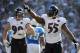 SAN DIEGO, CA - NOVEMBER 25: Terrell Suggs #55 and Paul Kruger #99 of the Baltimore Ravens celebrate a defensive stop on third down against the San Diego Chargers at Qualcomm Stadium on November 25, 2012 in San Diego, California. (Photo by Harry How/Getty Images)