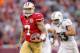 December 9, 2012; San Francisco, CA, USA; San Francisco 49ers quarterback Colin Kaepernick (7) runs for a 50 yard touchdown against the Miami Dolphins in the fourth quarter at Candlestick Park. The 49ers defeated the Dolphins 27-13. Mandatory Credit: Cary Edmondson-USA TODAY Sports