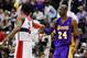 WASHINGTON, DC - MARCH 07: John Wall #2 of the Washington Wizards and Kobe Bryant #24 of the Los Angeles Lakers greet each other before the start of their game at the Verizon Center on March 7, 2012 in Washington, DC. NOTE TO USER: User expressly acknowledges and agrees that, by downloading and or using this photograph, User is consenting to the terms and conditions of the Getty Images License Agreement. (Photo by Rob Carr/Getty Images)