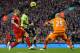 LIVERPOOL, ENGLAND - DECEMBER 15: Christian Benteke of Aston Villa watches his shot go wide past Daniel Agger and keeper Pepe Reina of Liverpool during the Barclays Premier League match between Liverpool and Aston Villa at Anfield on December 15, 2012 in Liverpool, England. (Photo by Clive Brunskill/Getty Images)