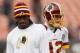CLEVELAND, OH - DECEMBER 16: Quarterback Robert Griffin III #10 of the Washington Redskins walks by quarterback Kirk Cousins #12 against the Cleveland Browns at Cleveland Browns Stadium on December 16, 2012 in Cleveland, Ohio. (Photo by Matt Sullivan/Getty Images)