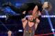 Ryback hoists Shield member Seth Rollins high over his head at Sunday's TLC pay-per-view in Brooklyn. (WWE.com photo)