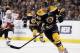 BOSTON, MA - JANUARY 05: David Krejci #46 of the Boston Bruins takes the puck in the third period against the Calgary Flames on January 5, 2012 at TD Garden in Boston, Massachusetts. The Boston Bruins defeated the Calgary Flames 9-0. (Photo by Elsa/Getty Images)