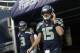 Aug 11, 2012; Seattle, WA, USA; NFL: Seattle Seahawks quarterbacks Matt Flynn (15) and Russell Wilson (3) walk on to the field for pregame warmups against the Tennessee Titans at CenturyLink Field. Mandatory Credit: Joe Nicholson-USA TODAY Sports