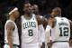 Nov 14, 2012; Boston, Massachusetts, USA; Boston Celtics guard Leandro Barbosa (12), forward/center Kevin Garnett (rear) and guard/forward Courtney Lee (left) congratulate forward Jeff Green (8) after he dunked the ball over Utah Jazz forward/center Al Jefferson (not pictured) during the fourth quarter at TD Banknorth Garden. The Boston Celtics won 98-93. Mandatory Credit: Greg M. Cooper-USA TODAY Sports