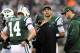 EAST RUTHERFORD, NJ - DECEMBER 02: Greg McElroy #14 of the New York Jets talks with quarterback coach Matt Cavanaugh while teammate Mark Sanchez#6 and Tim Tebow #15 stand by in the fourth quarter against the Arizona Cardinals on December 2, 2012 at MetLife Stadium in East Rutherford, New Jersey. The New York Jets defeated the Arizona Cardinals 7-6. (Photo by Elsa/Getty Images)