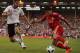 LONDON, ENGLAND - MAY 09: Luis Suarez of Liverpool is challenged by Aaron Hughes of Fulham during the Barclays Premier League match between Fulham and Liverpool at Craven Cottage on May 9, 2011 in London, England. (Photo by Scott Heavey/Getty Images)