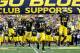 ANN ARBOR, MI - SEPTEMBER 08: Denard Robinson #16 and Roy Roundtree #21 of the Michigan Wolverines lead the team onto the field prior to playing the Air Force Falcons at Michigan Stadium on September 8, 2012 in Ann Arbor, Michigan. (Photo by Gregory Shamus/Getty Images)