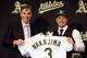 OAKLAND, CA - DECEMBER 18: Oakland Athletics vice president and general manager Billy Beane introduces Hiroyuki Nakajima of Japan to the Oakland Athletics at the O.co Coliseum on December 18, 2012 in Oakland, California. Nakajima signed a two-year contract through 2014 with a club option for 2015. (Photo by Ezra Shaw/Getty Images)