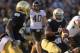SOUTH BEND, IN - NOVEMBER 17: Everett Colson #5 of the Notre Dame Fighting Irish pitches the ball to Cierre Wood #20 on a 60 yard touchdown play against the Wake Forest Demon Deacons at Notre Dame Stadium on November 17, 2012 in South Bend, Indiana. (Photo by Jonathan Daniel/Getty Images)