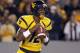 MORGANTOWN, WV - NOVEMBER 17: Geno Smith #12 of the West Virginia Mountaineers drops back to pass against the Oklahoma Sooners during the game on November 17, 2012 at Mountaineer Field in Morgantown, West Virginia. (Photo by Justin K. Aller/Getty Images)